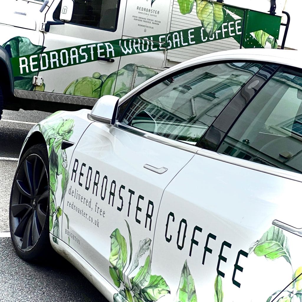 This image shows Redroaster coffee trucks parked outside the restaurant at Brighton Dome.